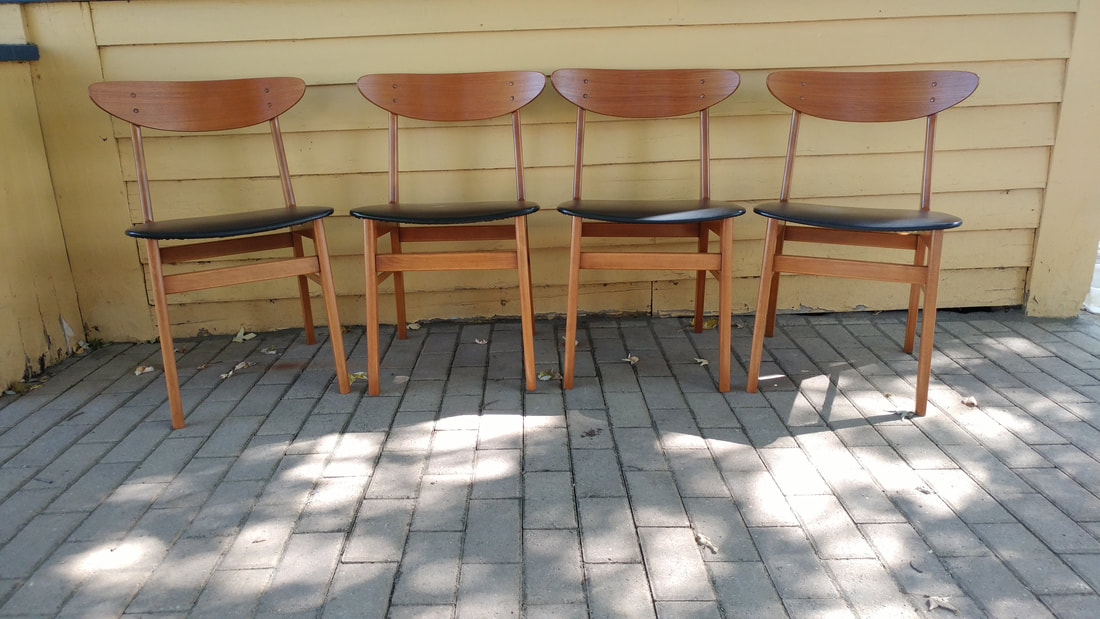 Set of 4 Farstrup mid century teak dining chairs. Black upholstered seats and wood back. Teak and beech frames. for sale